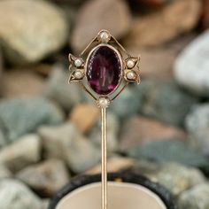 This lovely stick pin features an oval buff top amethyst and six seed pearl accents. Elegant Amethyst Brooches For Wedding, Amethyst Rings, February Birthstone, Stick Pins, Seed Pearl, Rings Jewelry, February Birth Stone, Fantasy Clothing, Amethyst Ring