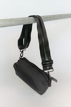 black nylon belt bag with black crossbody strap with shiny black leather detail Trendy Black Bag Strap For On-the-go, Urban Nylon Shoulder Bag With Adjustable Strap, Functional Black Belt Bag For On-the-go, Urban Nylon Chest Bag With Adjustable Strap, Sporty Shoulder Bag With Adjustable Strap For On-the-go, Versatile Nylon Chest Bag With Removable Pouch, Black Bag With Detachable Strap For Outdoor, Black Shoulder Bag Strap For Everyday Use, Modern Black Bag With Strap