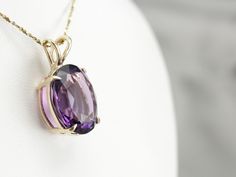 This amethyst gem is bursting with brilliant purple color! The oval cut faceting optimizes its luster, and the yellow gold only compliments the stone with its warm hue. This pendant could be worn everyday or for special occasions! This pendant does not come with the chain shown. Please feel free to contact us, we will help you find the perfect chain for your style and budget! Metal: 14K Yellow Gold Gem: Amethyst 14.00 Carats Gem Measurements: 17.7 x 14.5 mm, Oval Measurements: 26 x 15 mm, with b Luxury Amethyst Large Pendant Jewelry, Luxury Amethyst Oval Pendant Jewelry, Classic Oval Amethyst Necklaces, 14k Gold Oval Necklace In Purple, Elegant Oval Purple Gemstones, Elegant Purple Oval Gemstones, Purple Oval Diamond Cut Jewelry, Oval Purple Diamond Cut Jewelry, Faceted Oval Purple Jewelry