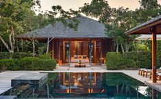 an outdoor living area next to a pool