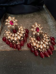 These antique Red Kundan earrings with red droplets will add the perfect charm to your festive wear. Length 8 cms Width 5.7 cms Weight 68 grams a pair Red Earrings Indian, Red Chandelier Earrings For Festive Parties, Red Chandelier Earrings For Party And Festive Occasions, Festive Red Chandelier Earrings For Party, Elegant Red Festive Danglers, Red Bridal Earrings For Festive Party, Red Bridal Earrings For Party, Elegant Red Chandelier Earrings For Festive Occasions, Festive Red Bridal Earrings For Party