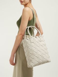 BOTTEGA VENETA   Daniel Lee Maxi Cabat 30 Leather Tote Bag in Mist (Ivory Beige-White) Small tote in the iconic double-face weave  Woven with wide, double-face soft nappa strips   Interior is identical to the exterior; fitted with a ring to attach a pouch or key holder   Smooth rolled nappa handles; slim, detachable crossbody strap  Gold finish hardware Made in Italy Height: 49 cm | 19.2"   Width: 38 cm | 14.9"   Depth: 13 cm | 5.1"  570800VMAH12030 Luxury Shoulder Bag With Interwoven Design And Double Handle, Luxury Shoulder Bag With Double Handle And Interwoven Design, Luxury Bags With Interwoven Design And Double Handle, Elegant Shoulder Bag With Interwoven Design For Shopping, Designer Shoulder Bag With Interwoven Design For Shopping, Luxury Shoulder Bag With Interwoven Design For Daily Use, Designer Bags With Interwoven Design For Daily Use, Designer Bags With Interwoven Design For Shopping, Elegant Shoulder Bag With Interwoven Design