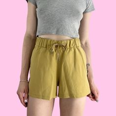 Lululemon Mustard Yellow Tie Athletic Shorts Drawstring closure with a stretchy waistband and pockets, great condition   Brand - LuluLemon Tag size - 6 Seen on size small, 5'4  Measurements (laying flat) Waist (no pull) 13.5 in  Hips (3 inches above crotch seam) - 20.75 in Rise - 10.5 in Inseam - 2.5 in #athleticshorts #lululemonshorts #yellowshorts #lululemon #yellowathleticshorts Casual Yoga Shorts, Casual Yoga Shorts With Elastic Waistband, Casual Drawstring Yoga Shorts, Casual High-waisted Shorts For Yoga, Casual Yoga Shorts With Drawstring, Lululemon Shorts, Yellow Ties, Lululemon Women, Yellow Shorts