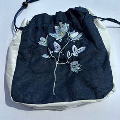 Mazexy Handmade Embroidered Handbag Wristle Small Shoulder Bag For Travel Shopping Wedding (Magnolia_flower) About This Item [Elegant Floral Embroidery] Beautifully Crafted Floral Design Embroidered On High-Quality Canvas, Making This Bag A Unique And Fashionable Accessory. [Versatile Design] Features A Drawstring Closure For Easy Access And Secure Storage, With An Adjustable Strap To Wear As A Handbag, Shoulder Bag, Or Crossbody Bag. [Stylish Dual-Tone] Denim Blue And White Canvas With Delicate Blue Embroidered Rectangular Pouch, Blue Bags With Floral Embroidery For Daily Use, Daily Use Blue Bags With Floral Embroidery, Blue Embroidered Bag As A Gift, Blue Floral Embroidery Bag For Everyday Use, Blue Floral Embroidered Bag For Everyday Use, Blue Floral Embroidery Bags For Everyday Use, Blue Bags With Floral Embroidery For Spring, Spring Floral Embroidered Pouch Shoulder Bag