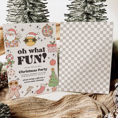 two christmas party flyers sitting on top of a wooden table next to pine cones and fir trees