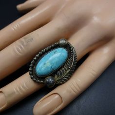 "VINTAGE NAVAJO RING DESCRIPTION: This exceptional old ring will be a treasured addition to your collection of fine vintage Native American jewelry. MEASUREMENTS: Ring face measures 1 1/4\" x 7/8\" Cabochon measures 21mm x 10mm RING SIZE: 5 3/4 WEIGHT: grams SIGNED: no STERLING: unmarked, verified sterling silver" Untreated Southwestern Style Ring Jewelry, Antique Collectible Cluster Ring, Retro Round Collectible Jewelry, Retro Collectible Jewelry, Southwestern Style Collectible Jewelry Ring, Southwestern Collectible Ring Jewelry, Vintage Handmade Ring Jewelry, Southwestern Style Collectible Ring, Handmade Vintage Ring Jewelry