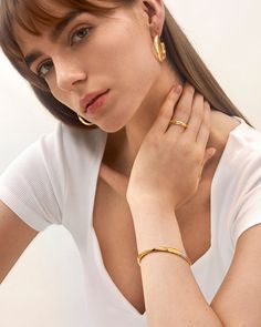 Select this eroded bangle bracelet for an effortless yet contemporary style, ideal for those who love a two-toned pattern fashioned into a subversive-basic design. Elevate your look with a casual and cool piece, perfect for any occasion.
Band Width: 5.5mm
Band Thickness: 3mm
Material: 18k Gold & Rhodium Plated Everyday Tarnish Resistant Cuff Bangle, Gold Plated Bangle Cuff Bracelet, Gold Plated Bangle Cuff Bracelet For Everyday, Modern Hoop Bangle For Everyday Wear, Modern Hoop Bangle For Everyday, Elegant Hoop Cuff Bracelet For Everyday, Fine Jewelry Everyday Bangle Bracelet, Everyday Gold-plated Jubilee Cuff Bracelet, Everyday Gold Plated Jubilee Cuff Bracelet