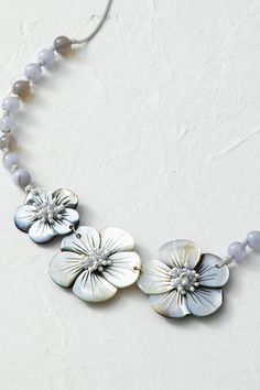 Luminous mother-of-pearl blossoms catch light on a strand of polished agate beads. | Women's Moon Flower Necklace - Silver Multi Elegant Flower-shaped Mother Of Pearl Necklace, Elegant Adjustable Shell Necklace With Natural Stones, Elegant Beaded Shell Necklace With Mother Of Pearl, Elegant Beaded Shell Necklace In Mother Of Pearl, Elegant Beaded Mother Of Pearl Shell Necklace, Adjustable Elegant Mother Of Pearl Shell Necklace, Elegant Shell Necklace With Natural Stones, Elegant Beaded Necklaces With Gemstone Beads, Mother Of Pearl, Adjustable Pearl Flower Necklace Elegant Style