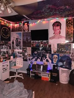 a room filled with lots of posters and lights