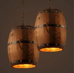 two wooden barrels with lights hanging from them