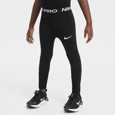 a man in black and white nike leggings, with the word's logo on