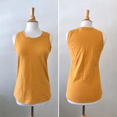 Basic cotton knit tank top.  This is a nice basic tank top that can be worn alone or layered. Length from shoulder to hem is about 25”  *Length can be adjusted for you as neededColor shown is Mustard Garments are Made To Order Please allow 7-10 days for your item to be sewnBelow are my standard size measurements, which are simply a guideline, if you would like to include your personal measurements in the notes to seller box during checkout, I will be sure to make you the best fit ~ if you have a Fitted Sleeveless Cotton T-shirt, Basic Solid Color Muscle Tank Tee, Basic Solid Sleeveless Top, Summer Cotton Tank Top With Crew Neck, Cotton Crew Neck Tank Top For Summer, Casual Plain Tank Top For Summer, Plain Stretch Tops For Summer, Casual Fitted Muscle Tee For Layering, Casual Fitted Sleeveless T-shirt