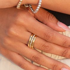 elevate your ring stack with our Sunset Lover Ring Stack. this premium set creates endless possibilities to elevate your jewelry capsule collection. wear each band individually or stack them together for a touch of luxury. the perfect addition for a sophisticated and minimal look. 18K gold pvd over 316L stainless steel water & tarnish resistant each band is 2mm thick set of 3 bands 1 cz bezel band, 2 solid bands Modern Stackable Rings For Everyday, Everyday Stackable Diamond Ring With Round Band, Elegant Stacked Gold Rings, Elegant Gold Stacked Rings, Modern Adjustable Stackable Diamond Ring, Fine Jewelry Stackable Rings With Double Band, Double Band Stackable Everyday Bands, Everyday Stackable Rose Gold Diamond Ring, Dainty Stackable Rings With Si Clarity