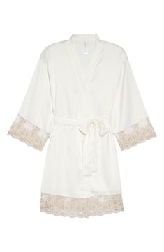 A lustrous satin robe edged with sheer floral lace is sure to make your mornings and evenings a little bit sweeter. 35 1/2" length (size Medium) Shawl collar Three-quarter sleeves Removable tie belt 100% polyester Hand wash, dry flat Imported Cream Satin Robe For Wedding Night, Elegant Delicate Lace Wedding Night Robe, Elegant Delicate Lace Robe For Wedding Night, Elegant Lace Robe With Lace Cuffs, Elegant Cream Robe For Wedding Night, Elegant Wedding Night Robe With Delicate Lace, White Lace Elegant Robe, Elegant Cream Silk Robe, Summer Wedding Night Lace Robe