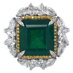 Stunning impressive ring set with a big Colombian emerald and diamonds. Colombian Emerald Minor 11.46 ct Gubelin certified,Minor Pear Shaped diamonds 2,7 Ct Brilliant cut diamonds 0,81 Ct Fancy yellow brilliant diamonds 0,77 Ct Material: 18 kt white gold Ring size: european 57 ( can be adjusted ) Total weight: 21.8 gram Diameter Head of ring: 25.1 mm Platinum Green Diamond Ring, Green Emerald Cut Diamond Gemstones, Green Diamond Platinum Ring With Prong Setting, Cluster Green Emerald Ring In Platinum, Green Diamond Ring With Diamond Accents, Green Emerald Cluster Ring In Platinum, Platinum Cluster Emerald Ring, Green Diamond Ring With Prong Setting, Green Platinum Emerald Ring With Cluster Shape