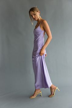 Stunningly elegant, the Emryn Open Back Maxi Dress is R.S.V.P. ready! This satin maxi dress features a ruched bust, empire waist fit, and strappy open back detailing! Available in Emerald Green and Lavender, pair with your favorite heels to complete the look! Details: Self: 96% Polyester, 4% Spandex Lining: 95% Polyester, 5% Spandex Back Zipper Elastic Back Straps Adjustable Straps Fully Lined Dry Clean Only Fitted Purple Backless Maxi Dress, Purple Fitted Backless Maxi Dress, Lavender V-neck Bohemian Maxi Dress, Purple Satin V-neck Maxi Dress, Green And Lavender, Purple V-neck Beachwear Maxi Dress, American Threads, Open Back Maxi Dress, Bogo Sale