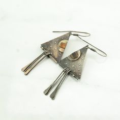 These vintage sterling silver earrings are 2"inches long, and 15/16" inch wide The earrings weigh 7.5 Grams The Stone/Theme is  Abstract Triangular, Copper Inlay  Markings: Unmarked, (Tested Sterling Silver guranteed to be so) The condition of the earrings is Estate, Great, heavy patina Extra Note:  1980 More unique vintage Silver earrings: https://www.etsy.com/shop/SilverStarrs925?section_id=13899305 NOTE: Variations in color in the pictures are due to reflections. The color in person is a beau Handmade Triangle Sterling Silver Jewelry, Modernist Silver Earrings For Gift, Handmade Silver Fish-shaped Earrings, Modernist Silver Metal Earrings, Modernist Sterling Silver Earrings, Vintage Silver Earrings, Modernist Jewelry, Unique Vintage, Vintage Sterling Silver