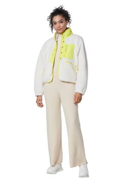 Stay cozily warm this season with this mixed media zip jacket with fleece contrasting. 22" length (size S) Stand collar 100% polyester Machine wash, line dry Imported Model stats: 5'10" height, 32" bust, 25" waist, 36" hip. Model is wearing size S. White Fleece Outerwear With Zipper Closure, Long Sleeve Sherpa Fleece Jacket With Zipper, Sporty Fleece Outerwear With Color Block, White Fleece Jacket With Zipper Closure, White Sherpa Outerwear For Outdoor, Sporty Sherpa Outerwear With Pockets, White Long Sleeve Fleece Jacket With Zipper, Sporty White Outerwear With Fleece Lining, Cozy Fit White Athleisure Outerwear