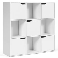 a white bookcase with four bins