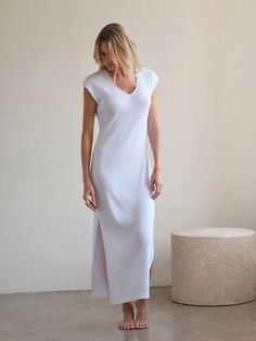 Our Supima Cotton Maxi Beach Dress is soft, comfortable, and durable, making it perfect for everyday wear. This dress’s indulgent use of luxury rib fabric means it floats on your body rather than hugging tight, making it ideal for a spring picnic or a breezy day at the beach. The Maxi Beach Dress can also be styled, with boots and a jacket, for a casual get-together with friends. The ribbed texture adds dimension with flexibility to the classic Maxi silhouette. Spring Dresses In Modal With Stretch, Spring Stretch Modal Dresses, Chic Stretch Modal Dresses, Sleek V-neck Maxi Dress For Spring, Sleek V-neck Maxi Dress For Summer, Spring Midi Dress With Side Slits For Loungewear, Solid Stretch Midi Dress For Loungewear, Sleek Solid Color Ribbed Dresses, Sleek Solid Ribbed Dress