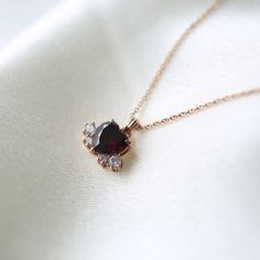 Garnet heart necklace 💝 * Details * Material : sterling silver with plate, 14k solid gold Color : Gold, white or rose gold Pendant Size : 11*8mm Heart stone : 7*7mm Round stone : 2.5mm, 1.7mm Chain Length : 16.5inch(If you want longer chain, please leave the length you need at the order note) We provide gift package with some our business card, Guarantee card, zip bag and caring tips card. Please check our shop policies and we love to hear from you about anything. Luxury Heart Pendant Necklace As Gift, Luxury Heart Pendant Necklace For Gift, Luxury Heart Pendant Necklace Gift, Luxury Heart-shaped Rose Gold Necklace, Luxury Heart-shaped Necklace For Gift, Luxury Red Heart Pendant Necklaces, Rose Gold Heart Pendant Necklace, Dainty Rose Gold Heart Cut Necklace, Tarnish Resistant Heart Pendant Necklace For Her