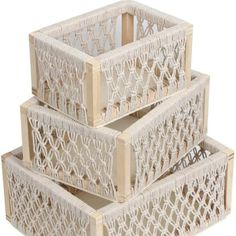 three white baskets stacked on top of each other