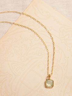 FACETED GEMSTONES: A tempting array of treasures, this collection pairs semi-precious gems with 22k gold-plated brass to highlight the stones' natural beauty and faceted cut.  Featuring brilliant labradorite, shimmering moonstone, and pearlescent prehnite.  A single stone pendant hangs from a gold-plated brass chain necklace.  Lobster clasp.  Length: 20" (51cm) Delicate Moonstone Gold Jewelry, Delicate Gold Moonstone Jewelry, Dainty Gold Moonstone Jewelry, Gold Moonstone Pendant Necklace, Gold Faceted Rectangular Pendant Jewelry, Yellow Gold Chalcedony Jewelry Gift, Gold Moonstone Necklace As Gift, Gold Moonstone Necklace For Gift, Dainty Gold Jade Necklace