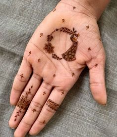 a person's hand with hennap on it and stars around the palm