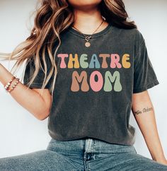 Theatre Mom T-Shirt, Theatre Mom Gift, Stage Mom Gift Shirt, Stage Mom Gift, Mom of Drama Tee, Mom of Drama Gift, Mom Acting Shirt, Trending Shirt Welcome to my store! I will help you to have a good shopping experience as much as I can. If you have any request (design customization, more size and color options) please feel free to message me. I will reply as soon as possible. I have listed some information to help you below:  HOW TO ORDER  * Please, Check and Review all Photos. * Select Your T-S Relaxed Fit Graphic Print Top For Mother's Day, Funny Cotton T-shirt With Lettering, Cotton Graphic Tee With Lettering, Mother's Day Cotton Slogan Tops, Funny Short Sleeve T-shirt With Lettering, Funny Print Crew Neck Top For Mother's Day, Mother's Day Graphic Tee With Relaxed Fit, Graphic Tee With Relaxed Fit For Mother's Day, Mother's Day Relaxed Fit T-shirt With Text Print