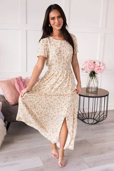 The Caitriona Modest Floral Dress - NeeSee's Dresses Casual Floral Dress With Smocked Back And Short Sleeves, Casual Floral Short Sleeve Dress With Smocked Back, Flowy Floral Dress With Smocked Back And Short Sleeves, Floral Dress With Smocked Bodice For Garden Party, Feminine Short Sleeve Maxi Dress With Smocked Back, Modest Beige Maxi Dress With Short Sleeves, Feminine Maxi Dress With Smocked Bodice And Short Sleeves, Modest Short Sleeve Floral Dress For Garden Party, Modest Short Sleeve Maxi Dress For Garden Party