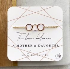 "\"the love between a mother & daughter is forevermore\" Triple entwined rings bracelet with lobster clasp and 1/2\" extender chain to allow for adjustability for the perfect fit ~artisan made triplet of linked rings with a hammered texture; each ring is approx 8mm in size. ~available in sterling silver, 14kt gold filled or 14kt rose gold filled ~All other metal components are sterling silver, 14kt gold filled or 14kt rose gold filled ~Comes packaged on \"mother & daughter...forevermore\ Adjustable Jewelry For Anniversary And Mother's Day, Adjustable Jewelry For Mother's Day Anniversary, Adjustable Meaningful Jewelry For Mother's Day, Meaningful Adjustable Jewelry For Mother's Day, Elegant Adjustable Bracelet As Gift For Mom, Elegant Adjustable Bracelets As Gift For Mom, Mother's Day Infinity Jewelry With Adjustable Chain, Adjustable Infinity Jewelry Gift For Mom, Adjustable Infinity Jewelry As Gift For Mom