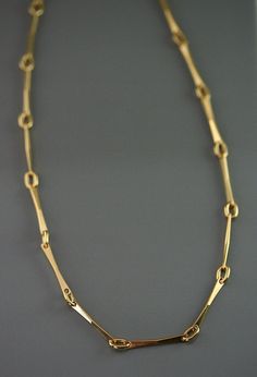 This handcrafted chain is of a big simplicity with these lines and these pure curves, drawn and made carefully to my workshop ; all the rings are welded one by one. The style is subtle and modern and will make a beautiful passkey for a smart holding look or relaxed one. This jewels is made of solid gold, 10 k or 14 k.  A beautiful present for the birthday, Mother's Days, marriage, Christmas or to offer itself to oneself! return to my shop : https://www.etsy.com/ca/shop/stephanielemelin?ref=listing-shop2-all-items-count#items Elegant Cable Chain Necklace In Recycled Gold, Elegant Recycled Gold Chain Necklace, Modern 14k Gold Snake Chain Necklace, Minimalist 14k Gold Formal Chain Necklace, Minimalist 14k Gold Formal Necklace, Modern Yellow Gold Long Chain Necklace, Minimalist Long Yellow Gold Chain Necklace, Modern Long Yellow Gold Chain Necklace, Minimalist Yellow Gold Long Chain Necklace