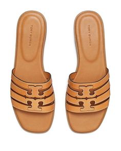 Fits true to size, order your normal size.Open toe.Slip on.Leather upper and lining, rubber sole.Imported.Web ID: 5020642 Classic Tan Sandals With Leather Sole, Classic Tan Sandals With Leather Lining, Tan Leather Footbed Slip-on Sandals, Classic Flat Slides With Removable Insole, Classic Slip-on Sandals Medium Width, Classic Sandals With Flat Heel And Rubber Sole, Classic Tan Sandals For Spring, Flat Sandals With Buckle Closure Medium Width, Flat Sandals With Buckle Closure And Medium Width