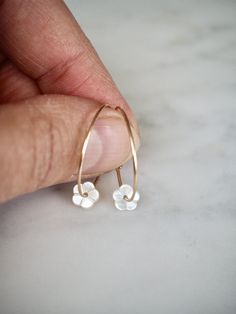 "Gold Filled Hoop Earrings, Tiny White Mother of Pearl Flower Hoop Earrings, Gold Hoop Earrings, Gold Earrings, Flower Hoops, Bridal Earrings, Gift for Her, Romantic Earrings, Feminine Earrings, Small Hoops, Dainty Earrings, MOP Earrings Adorable, feminine and lightweight 14k gold filled hoop earrings with the sweetest and tiniest carved white mother of pearl flowers. D E T A I L S: => Metal Type - 14k Gold Filled => Hoop size - Approx. 2 cm in diameter => Length - Approx 2 cm / 0.78\" Everyday Flower Charm Hoop Earrings, Delicate Hypoallergenic Flower Earrings For Everyday Wear, Dainty Hoop Flower Earrings Gift, White Minimalist Nickel-free Flower Earrings, Everyday 14k Gold Filled Flower Jewelry, Tiny Minimalist Flower Earrings, Small Hoop Jewelry With Flower Charm For Everyday, Tiny Delicate Hoop Jewelry, Dainty Hoop Earrings With Flower Charm