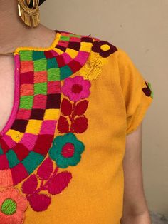 "Pretty Mexican top. Hand-embroidered with colourful flowers. Made with Muslin-soft and comfortable. Fits size Small Measurements taken flat: Armpit to armpit 21\" Bottm hem width 21 1/2\" Shoulder to bottom hem 27\"" Mexican Top, Mexican Blouse, Mexican Outfit, Colourful Flowers, Comfortable Fits, Gingham Fabric, Jeans Diy, Womens Blouses, Embroidered Blouse