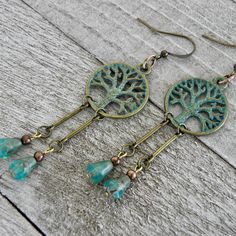 "If you are down to earth and prefer the simple life these woodland beaded dangle earrings are just for you. The turquoise green patina brass tree of life charms provides an earthy contrast to the faceted Czech glass teardrop beads. Your spirits are guaranteed to be lighten with these soulful handmade earrings that sway harmoniously with movement.   Earrings are measured from the base of the earwire 4 Small pairs in stock - 17 x 20mm Tree of Life Charm and 1 5/8\" in length 2 Large pairs in stoc Nature-inspired Beaded Dangle Earrings As Gift, Nature-inspired Dangle Beaded Earrings As Gift, Nature-inspired Dangle Beaded Earrings For Gift, Handmade Nature-inspired Dangle Beaded Earrings, Earthy Beaded Dangle Earrings As Gift, Nature-inspired Jewelry With Dangling Beads For Gifts, Rustic Green Earrings For Gifting, Rustic Dangle Earrings As A Gift, Rustic Dangle Earrings For Gift