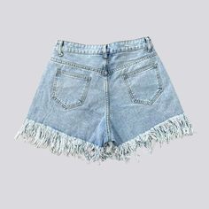 Trendy Denim Blue Bottoms With Fringe, Trendy High Rise Bottoms With Fringe, High Waist Fringe Shorts For Spring, High-waist Fringe Shorts For Spring, Spring High-waist Fringe Shorts, Summer High Waist Jeans With Fringe, Summer Cotton Jean Shorts With Fringe, Trendy Cotton Fringe Shorts, Trendy Fringed Shorts For Summer