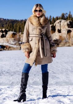 Delivering huge fashion impact with maximum warmth, our Dakota Fox coat SCORES! In luxe Latte vegan suede, the supple, soft hand ensures a fluid, compact silhouette. A luxurious Taupe Fox collar adds lush, plush warmth, along with the bonus of a strong shoulder. Continuing along the center front to the hem, this super-soft fur adds style AND verticality. With Chocolate tipping for authenticity, Taupe Fox is repeated in the adjustable cuffs. Inside a sheared fur lining provides welcome warmth while body-skimming princess seams front and back, provide a lean fit. Bold Chocolate whipstitching accents the flap pockets, sleeve belts, the boundless details and seaming! A tie belt, worn either front or back, pulls together this 37" coat that hints of effortless elegance and quiet confidence. Perf Elegant Sheepskin Outerwear For Fall, Winter Sheepskin Outerwear With Faux Fur Trim, Fall Sheepskin Outerwear With Faux Fur Lining, Fall Outerwear With Faux Fur Lining And Sheepskin, Elegant Shearling Outerwear With Faux Fur Trim, Elegant Long Sheepskin Coat, Elegant Shearling Outerwear For Fall, Elegant Fall Shearling Outerwear, Elegant Long Shearling Coat