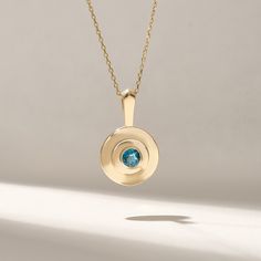 Elevate your style with our Natural Blue Topaz Necklace in 14k Solid Yellow Gold. This unique round pendant exudes timeless elegance, featuring a captivating blue gemstone. The disc pendant design adds a modern touch, making it a standout statement piece. Crafted with precision and care, this necklace is a perfect addition to your jewelry collection. Whether for casual or formal occasions, the combination of the mesmerizing blue topaz and the richness of solid gold creates a stunning accessory that complements any outfit. Features * Made to Order * Gold KT: 14KT * Custom Gold Color:  Yellow Gold * Charm 24.15 mm x 14.75 mm * Charm Thickness: 4.50 mm * Bail: 5.25 mm * Gemstone: Natural Blue Topaz * Total Ctw: 0.30 ctw * Ready to Ship in 5-7 Business Days ✓ We care about the environment,the Blue Topaz Birthstone Necklace In Fine Jewelry Style, Anniversary Blue Topaz Round Necklace, Timeless Gemstone Round Pendant Necklace, Blue Round Birthstone Necklace In Fine Jewelry Style, Blue Topaz Birthstone Jewelry With Round Stone, Blue Topaz Birthstone Jewelry, Elegant Round Birthstone Necklace With Polished Finish, Blue Round Birthstone Necklace For Formal Occasions, Blue Round Birthstone Necklace For Formal