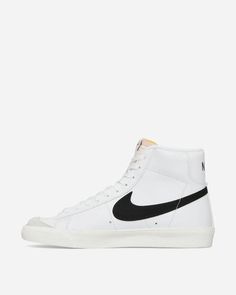 Nike WMNS Blazer Mid '77 Vintage Sneakers White / Black / Sail.One of Nike's historical models, which never goes out of trend. Conceived as a basketball shoe, it has evolved to become a lifestyle model to be worn every day, thanks to its ultra-soft high collar and the chance of wearing it anywhere..Leather Upper.Suede Overlays.Foam Tongue.Rubber Outsole.Style Code: CZ1055-100 Retro Nike High-top Sneakers For Skateboarding, White Throwback High-top Sneakers With Rubber Sole, Classic Basketball Shoes With Gum Sole For Streetwear, Classic Basketball Shoes With Vulcanized White Sole, Classic High-top Lace-up Sneakers For Streetwear, Classic Lace-up High-top Sneakers For Streetwear, Retro Nike High-top Sneakers With Gum Sole, Nike Sporty High-top Sneakers With Gum Sole, Classic Basketball Shoes With Gum Sole And Round Toe