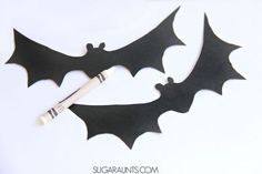 the black bats are cut out to look like bats