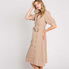 Elevate your wardrobe with our Asymmetrical Button-Down Wrapped Midi Dress, a true embodiment of timeless elegance and style. This dress offers a perfect blend of sophistication and modern flair, ensuring you'll look effortlessly chic and feel confident on any occasion. Key Features: Half-Sleeve Design: The dress features a half-sleeve with button closure, providing a touch of modesty and versatility. You can adjust the sleeves to your preference, making it suitable for various weather condition Classic V-neck Midi Dress With Buttons, Semi-formal Button-up Dress With Button Cuffs, Classic V-neck Shirt Dress With Button Closure, Solid Maxi Dress With Button Closure, Spring A-line Midi Dress With Button Closure, Fitted V-neck Midi Dress With Button Cuffs, Maxi Dress With Button Closure, Elegant V-neck Shirt Dress With Button Closure, Elegant Summer Shirt Dress With Buttons