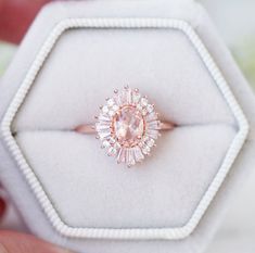 Beautiful Victoria Morganite Art Deco Ring ►Vintage Inspired design ►Base Metal: Sterling Silver (925) ►Plating: 14K Rose Gold ►Accented With Simulated Diamonds (CZ) ►Average band width: 1.8 mm ►Halo size: 13.5 mm x 12.1 mm Main Stone: Morganite Gemstone Creation: Lab-Created Stone Shape: Oval Cut Gem size: 7.0 x 5.0 mm Carat Weight: 0.76 ct. (Approx.) ►This ring can be customized to natural morganite, or any other gemstone of your choice. Please contact us if you have special requests. ►Please Pink Gold Rose Cut Diamond Wedding Jewelry, Pink Gold Jewelry With Rose Cut Diamonds For Weddings, Wedding Rings In Pink Gold With Rose Cut Diamonds, Vintage Wedding Jewelry With Halo Design, Vintage Jewelry With Halo Design For Wedding, Blush Gemstone Jewelry For Wedding, Rose Gold Cluster Ring With Center Stone For Wedding, Pink Cluster Ring With Prong Setting For Wedding, Pink Cluster Ring With Center Stone For Wedding