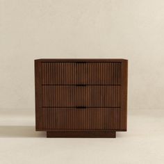 a small wooden dresser with three drawers