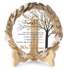 a wooden plaque with an image of a tree in the center and a poem written on it