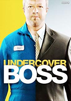 a man wearing a suit and tie standing in front of a yellow background with the words undercover boss on it