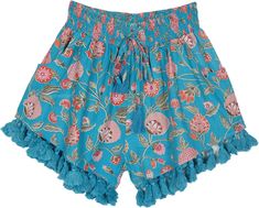 teal blue colored bohemian cotton shorts with a beautiful pink floral print - the shorts have a smocking elastic waist with a drawstring that has tassels attached to its ends.  The bottom of the shorts also have similar tassels for a funky bohemian look. #tlb #Pocket #beachwrap #Floral #Printed #bohemianfashion #bohoshorts #shortswithtassels Hippie Beach Shorts For Spring, Bohemian Drawstring Bottoms For Summer, Bohemian Drawstring Bottoms For Beach Season, Bohemian Drawstring Shorts For Beach Season, Bohemian Shorts For Spring Vacation, Summer Vacation Boho Print Bottoms, Bohemian Shorts For Spring, Spring Bohemian Shorts, Summer Beach Boho Print Bottoms