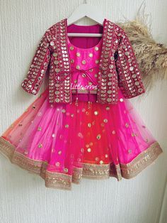 ✨ Girl blush pink bright  Lehenga is a beautiful dress that will keep your little girl happy and looking adorable all day long. ✨ The Gorgeous  Pink & orange  Lehenga with jacket is perfect for any occasion. The stunning  pink lehenga comes with a jacket only ( no chunni ) . This beautiful and elegant Indian outfit is made of a soft fabric that is perfect for those looking for a comfortable yet beautiful outfit for any occasion. The blouse features a feminine pink color embroidery.  ✨ This Beautiful Lehenga is ideal for the festive season and perfect for those wanting to celebrate with their little ones. This beautiful Indian outfit is perfect for any occasion and the beautiful design is a perfect contrast to the vibrant colors and will surely make a statement. The  pink lehenga and jacket Pink Ruffled Choli For Navratri, Pink Ruffled Lehenga For Diwali, Pink Sets With Gota Work For Navratri, Red Ruffled Lehenga For Diwali, Pink Gota Work Sets For Navratri, Festive Pink Lehenga With Ruffles, Red Ruffled Sets For Diwali, Bollywood Style Pink Sets With Gota Work, Bollywood Style Multicolor Ruffled Sets