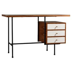 an office desk with two drawers on one side and a metal frame around the top