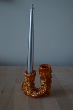 a candle holder made out of an old pair of boots